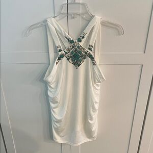 White halter top with beaded embellishment. Cache size M